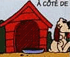Le chien est � c�t� de la niche.